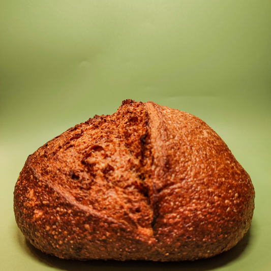 Loaf of bread on a green background