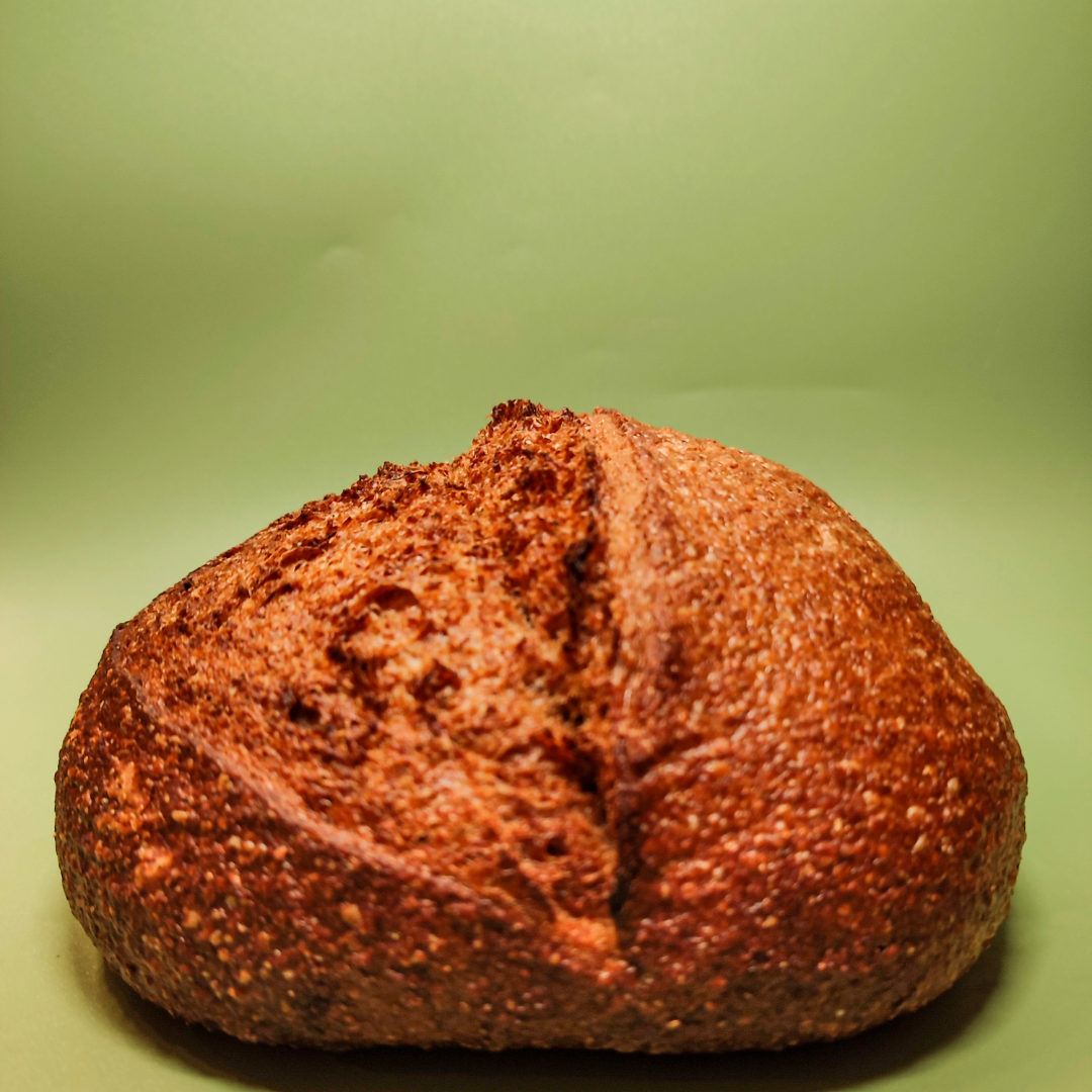 Loaf of bread on a green background